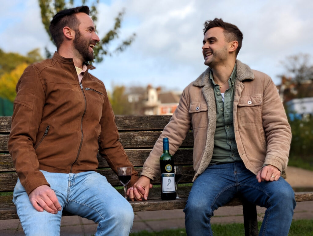 Adam and Dan holding hand for the Pride Wide Barefoot Wine campaign